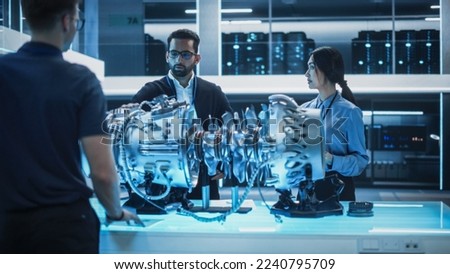 Thrust Engine Engineer, Project Manager and Machinery Operator Work on a Futuristic Turbine Motor, Standing with Tablet Computer in Scientific Technology Lab. Professional Team Developing a Prototype.