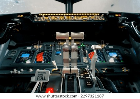 thrust lever in the cockpit of an airplane a close-up view of a flight on aircraft simulator