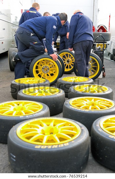 THRUXTON, UNITED KINGDOM - MAY 1: Pirtek pit
crew making tire choices before racing in the British Touring Car
Championships. May 1, 2011. Thruxton,
UK