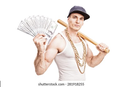 Thug with gold chain around his neck holding a baseball bat and a stack of money isolated on white background