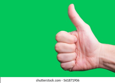 Thumb up hand gesture. Like internet symbol in real life. OK approval sign isolated. Empty copy space success background. Hand on green screen. - Powered by Shutterstock