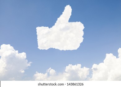 Thumb up and like concept symbol in clouds on blue sky