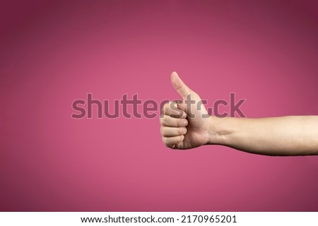 Thumb up symbol on vignetting dark pink background for banner advertising., Clipping Paths. Stockfoto © 