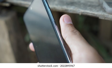 A thumb will press the fingerprint sensor. Side-mounted fingerprint sensors