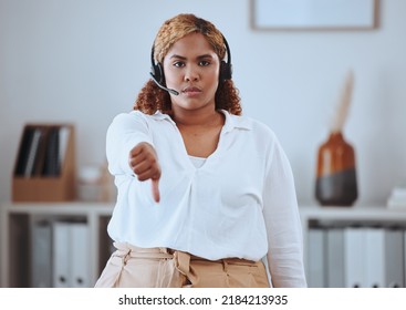 Thumbs Down From Call Center Agent, Annoyed And Angry While Wearing A Headset. Portrait Of A Young Woman Feeling The Pressure Of A Bad Workplace, Frustrated And Unhappy At Her Job, Work Environment