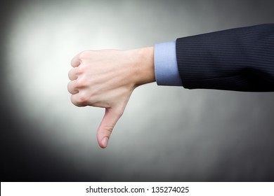 Thumbs Down Hand Sign Showing By Man