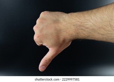 Thumbs down sign isolated on background. Unlike, bad, unapproved or failed gesture. - Shutterstock ID 2229997581
