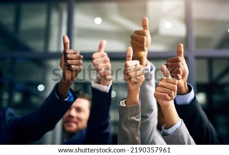 Thumbs up with hands of a business team or group giving their approval, saying thank you or giving motivation together in their office at work. Corporate professionals supporting with trust