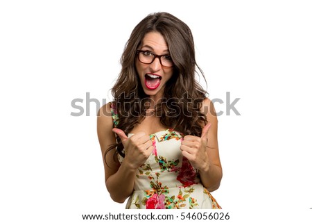 Thumbs up from quirky spirited fun goofy woman in glasses celebrating joy happiness 