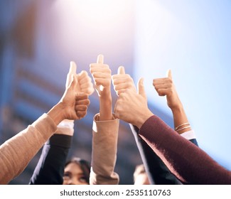 Thumbs up, group or people in agreement with hands on blue sky outdoors. Teamwork, collaboration or community diversity and colleagues in support gesture outside in city background with flare mockup - Powered by Shutterstock