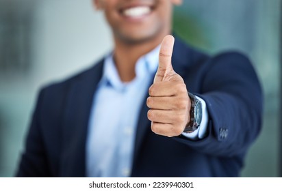 Thumbs up, success and hand of businessman in the office with an approval, agreement or positive gesture. Happiness, successful and professional male employee with a thank you thumbsup in workplace.