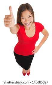 Thumbs up woman. Fun high angle full body portrait of a vivacious laughing woman giving a thumbs up gesture of approval as she looks at camera, isolated on white background. Mixed race businesswoman