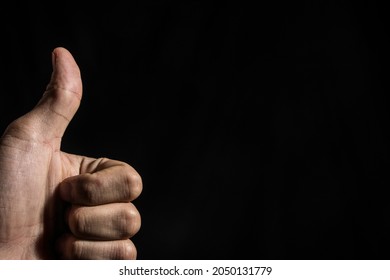 Thumbsup on a black background
