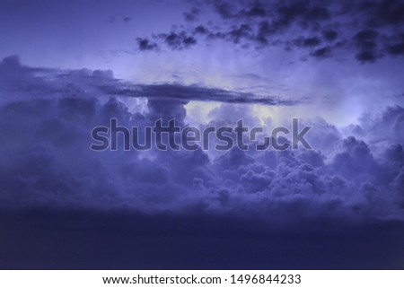 Thunder clouds lighting up the night sky near Oakboro North Carolina.