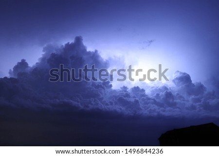 Thunder clouds lighting up the night sky near Oakboro North Carolina.