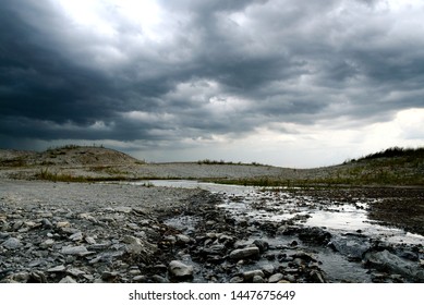 Thunder Clouds Roll In Over A Shallow Creek In Frisco, TX