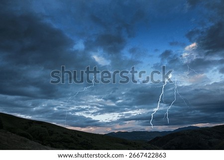 Thunder and flash. Sunset and dramatic clouds at Lindis Pass. Landscapes and scenes South Island New Zealand