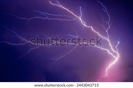 Thunder lighning storm strike lights in night of Monsoon in sky.