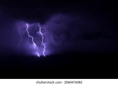 Thunder Storm over Jura, back background, purple lightenings - Powered by Shutterstock