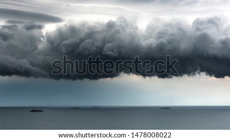 Thunderclouds over the sea, thunderstorm in the sea