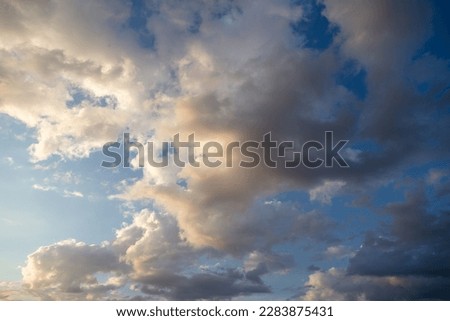 Thunderclouds in the sky at sunset. Background