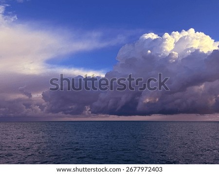 Thunderclouds storm clouds over ocean. 