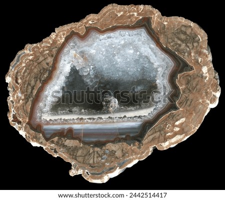 A thunderegg agate geode specimen from the location known as Blue Ridge, New Mexico. A quartz geode with waterline agate surrounded by a mottled rhyolite matrix. 