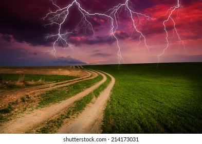 Thunderstorm With Lightning In Dirt Road.