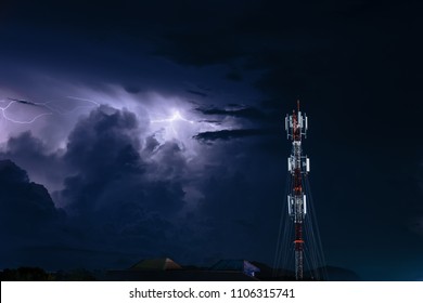 Thunderstorm With Lightning Over The Cell Phone Antenna Tower At Night