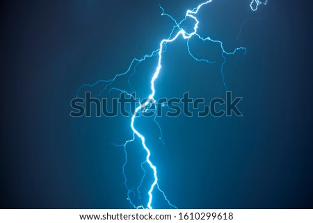 Thunderstorm in the night with dramatic and colorful clouds