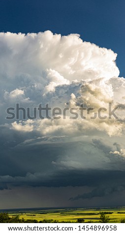 Thunderstorms on the open prairies of North Dakota, nimbus clouds high above the plains.