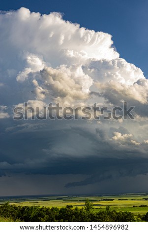 Thunderstorms on the open prairies of North Dakota, nimbus clouds high above the plains.