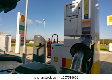 Thurcaston, Leicestershire / UK - March 25, 2019: Shell Filling Station with Semi Truck Being Fuelled Angle from the Top of the Fuel Tank Looking back at the Fuel Pump 
