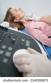 Thyroid Scan Of Caucasian Woman Lying On Couch In Endocrinology Office