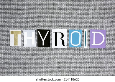 Thyroid word on grey background