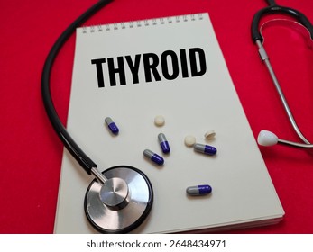 Thyroid Word Written on Notebook with Stethoscope Representing Endocrine System Disorder, Hormonal Health Issues, Diagnosis, and Medical Checkup Concept. 