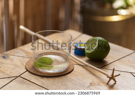 'Ti Punch Cocktail from the french caribbean islands with Rhum Agricole, Sugar and Lime prepared with the traditional 