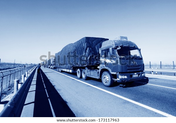 TIANJIN - DECEMBER 9: heavy duty trucks stopped on the
highway Because of the traffic jam, on December 9, 2013, tianjin,
China.  