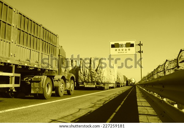 TIANJIN - DECEMBER 9: heavy duty trucks  stopped on the\
highway Because of the traffic jam, on December 9, 2013, tianjin,\
China.  