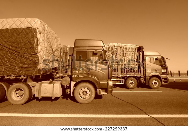 TIANJIN - DECEMBER 9: heavy duty trucks  stopped on the
highway Because of the traffic jam, on December 9, 2013, tianjin,
China.  