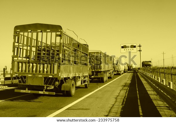 TIANJIN - DECEMBER 9: The heavy duty trucks were stopped
on the highway Because of the traffic jam, on December 9, 2013,
tianjin, China.  