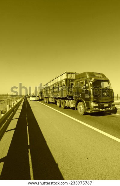 TIANJIN - DECEMBER 9: The heavy duty trucks were stopped
on the highway Because of the traffic jam, on December 9, 2013,
tianjin, China.  