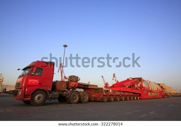 TIANJIN PORT - MARCH 22: a multi-axis heavy-duty truck\
parked in the terminal yard, on March 22, 2015, tianjin port,\
tianjin, China. \

