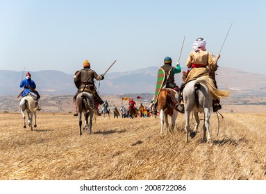 Tiberias, Israel, July 02, 2021 : Horse and foot warriors - participants in the reconstruction of Horns of Hattin battle in 1187, are on the battle site, near TIberias, Israel