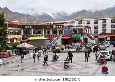Tibet, Lhasa, China, June, 03, 2018. Motorbikes on the street in the historical center of Lhasa in front of the pharmacy and chain fast food restaurant Dicos. Tibet, China