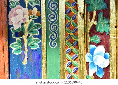 Tibetan patterns on wooden doors of monastery in Tibet.