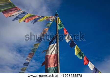 Tibetan pennants in the wind on a sunny day.