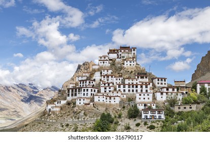 Tibetan style Key monastery on top of hill among mountains