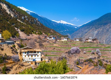The Tibetan village in the mountains. Taken in the entry of Baimang Snow Mountains that was listed into National Nature Reserve. It is located in the northwest of Yunnan China.