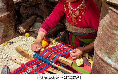 Tibetan Woman Weaving A Cloth
